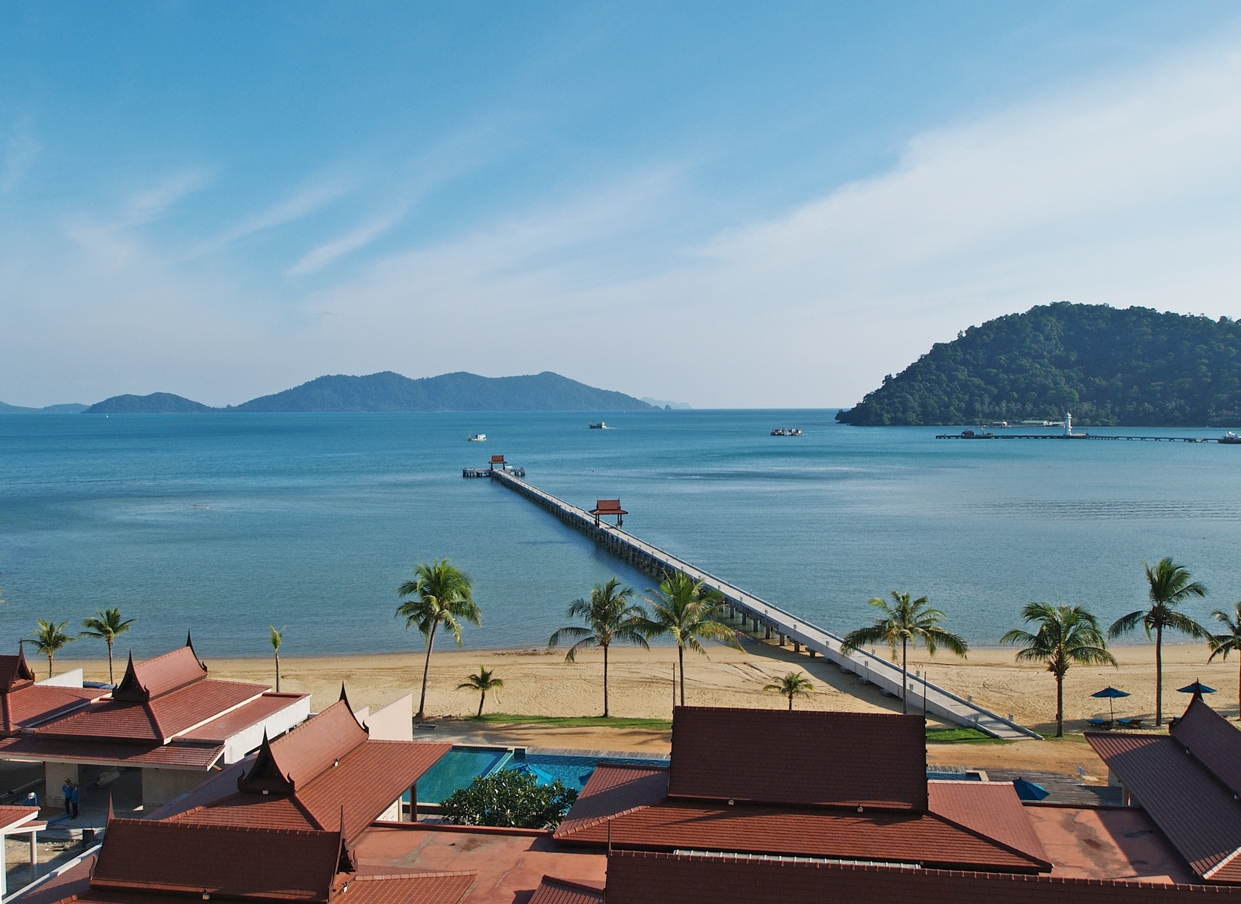 Luxury beachfront penthouse in Koh Chang with freehold ownership, stunning sea views, spacious living area, modern Thai design, high ceilings, private pier, and fully furnished with a large kitchen. Listed with Koh Chang Properties.