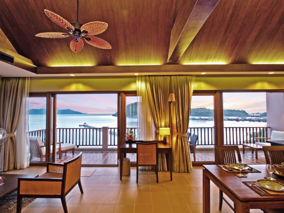 Luxury beachfront penthouse in Koh Chang with freehold ownership, stunning sea views, spacious living area, modern Thai design, high ceilings, private pier, and fully furnished with a large kitchen. Listed with Koh Chang Properties.